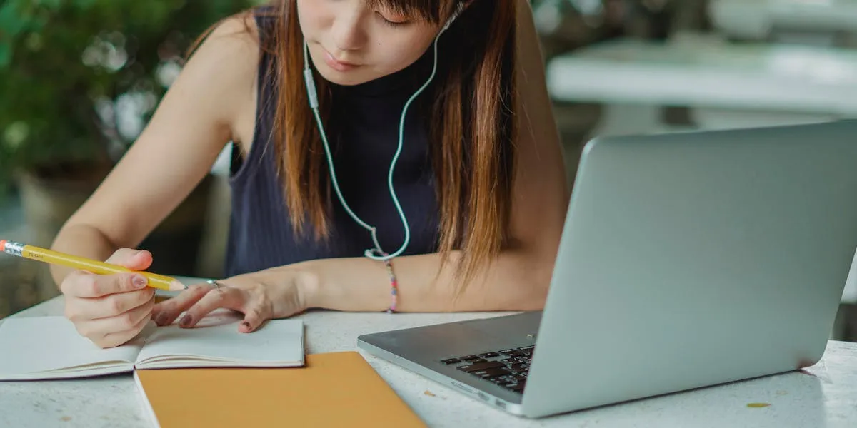 Focused writing and studying with laptop
